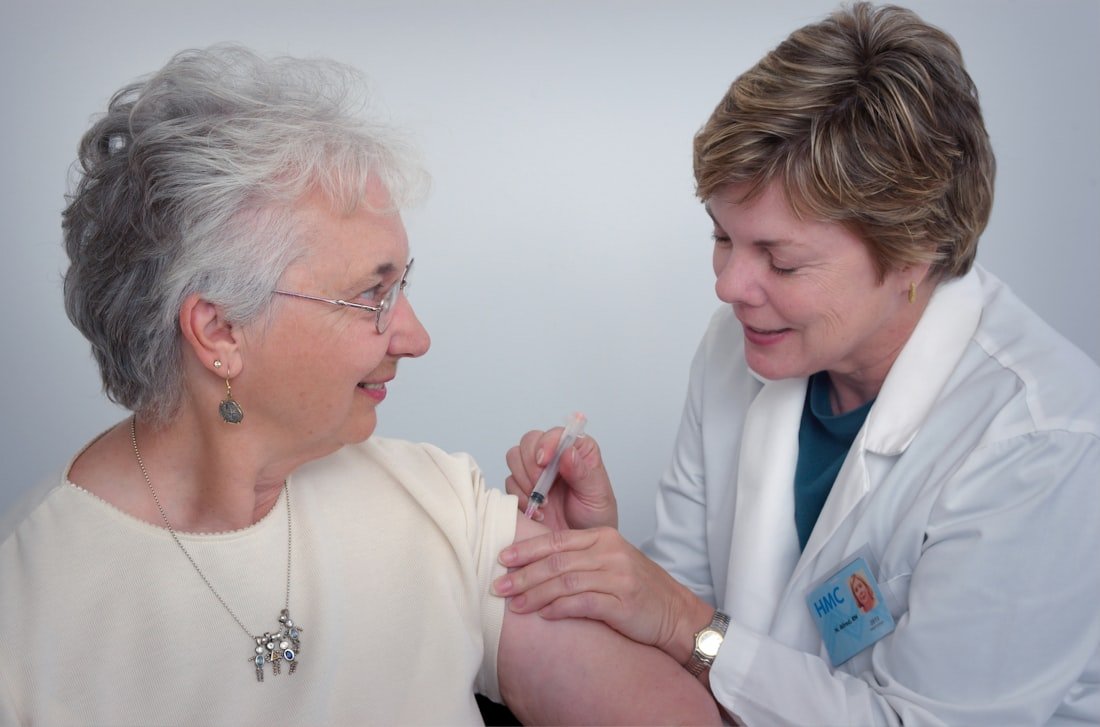 A clinician caring for a patient during an in-clinic visit